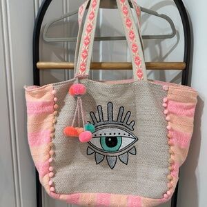 America & Beyond tote bag with zip enclosure.